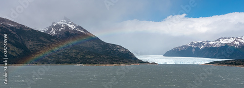 Views of The Perito Moreno Glacier and a rainbow on a sunny day. Argentina