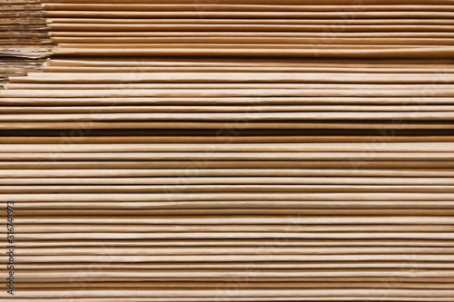 Texture of a large stack of brown paper, background