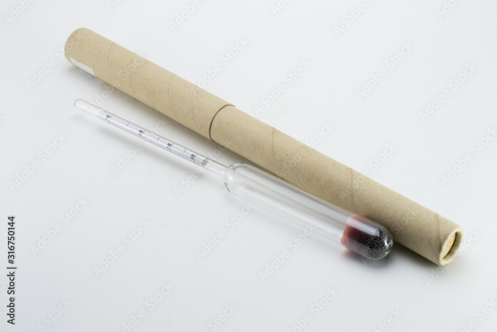 Naklejka premium Glass transparent alcohol meter. For measuring alcohol strength. With a case.