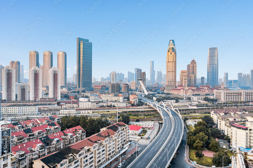 Early morning city scenery of Chifeng Bridge in Tianjin, China