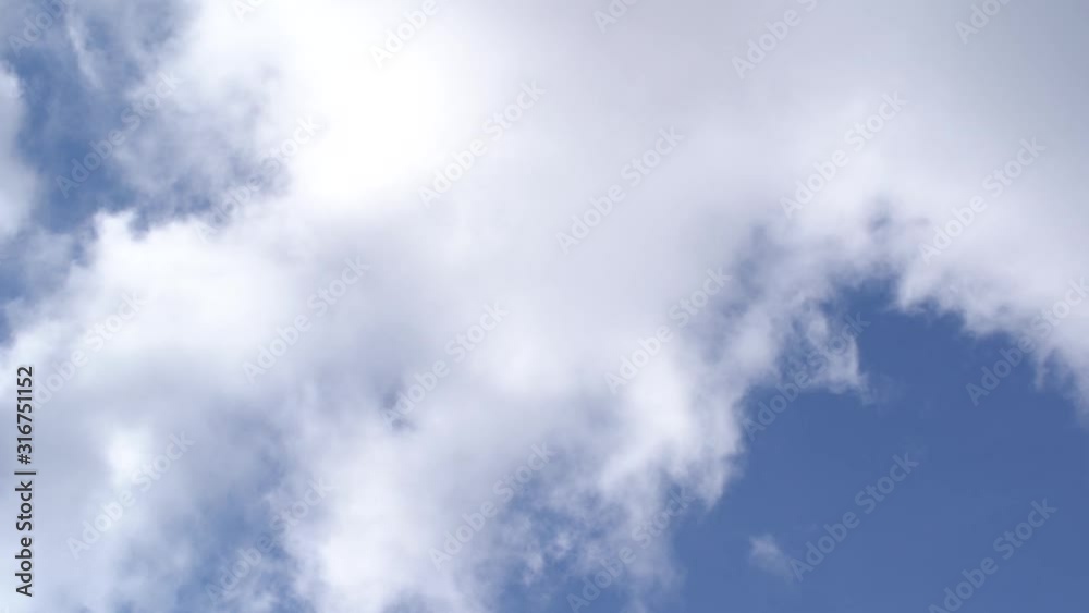 Beautiful sunny clear blue heaven with fluffy white clouds and grey rainy clouds moving along sky. Changeable weather concept. Video time lapse. Beautiful sunny clear blue heaven with fluffy white clouds and grey rainy clouds moving along sky. Changeable weather concept. Video time lapse.