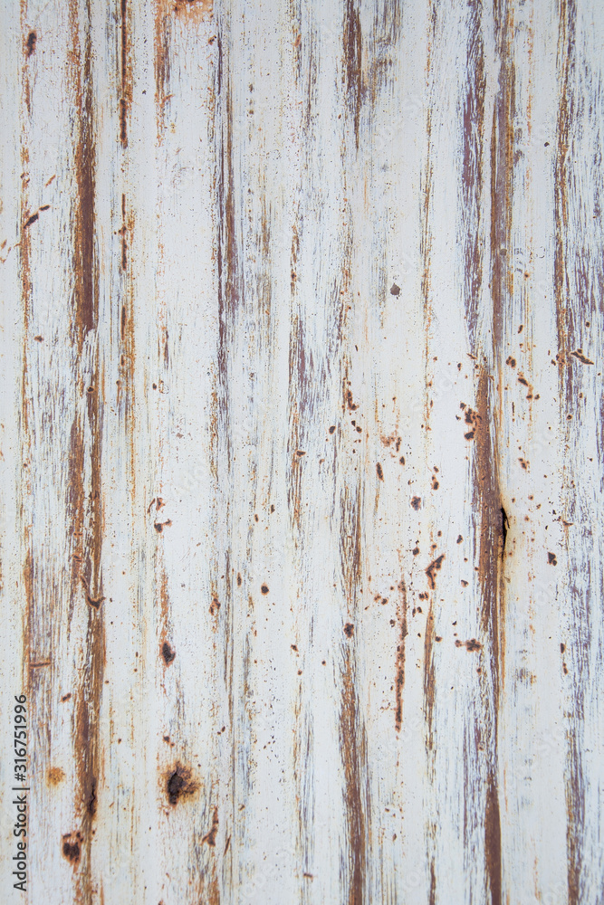 The metal wall is white-brown, rusty, with corrosion of metal. Texture or background The metal wall is white-brown, rusty, with corrosion of metal. Texture or background