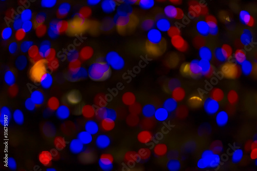 Bokeh and flare of blured background in nightclub. Fresh healthy blue red background with abstract blurred foliage and bright summer sunlight and a central copyspace for your text or advertismen photo