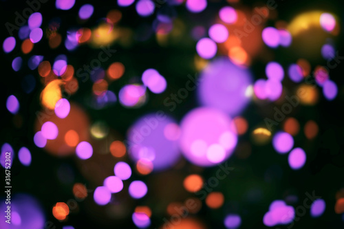 Bokeh and flare of blured background in nightclub. Fresh healthy blue red background with abstract blurred foliage and bright summer sunlight and a central copyspace for your text or advertismen