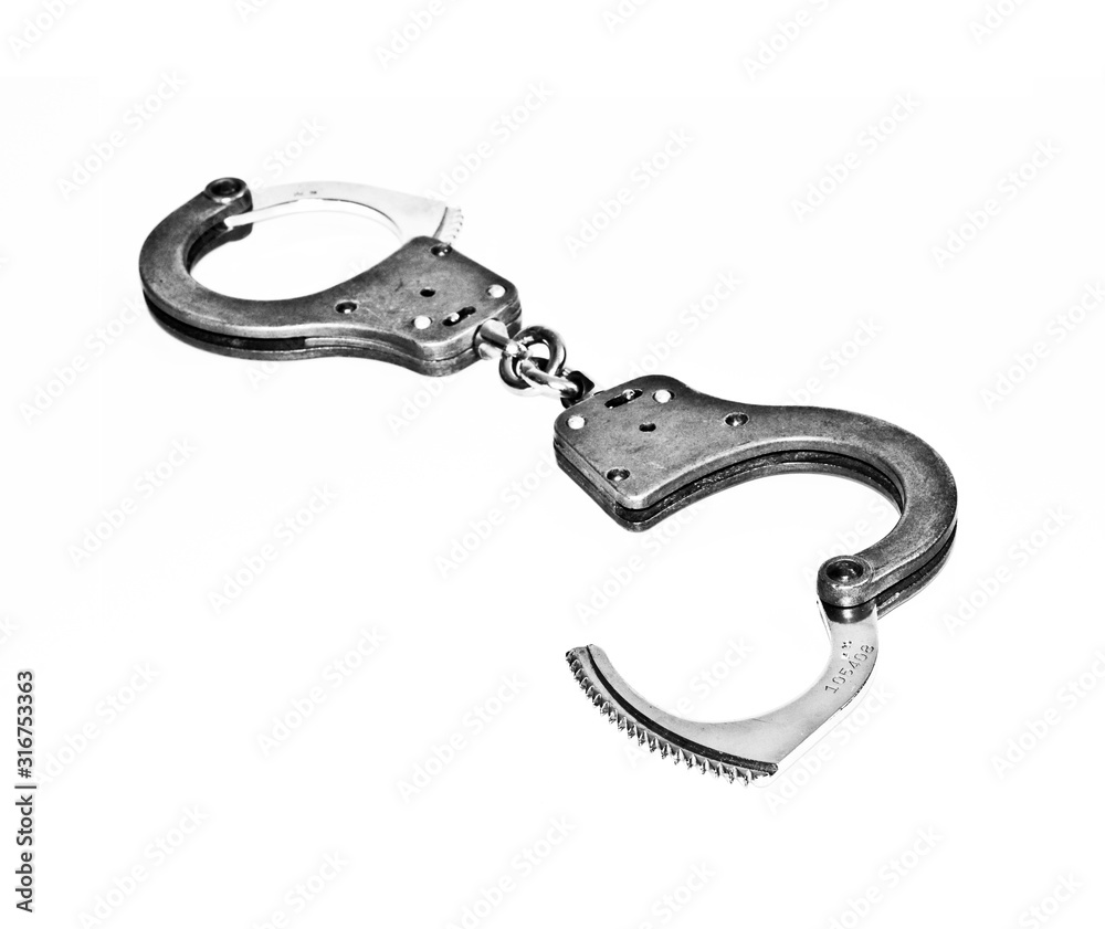 Police handcuffs on white