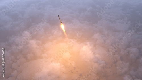Fototapeta Naklejka Na Ścianę i Meble -  Rocket flying over clouds