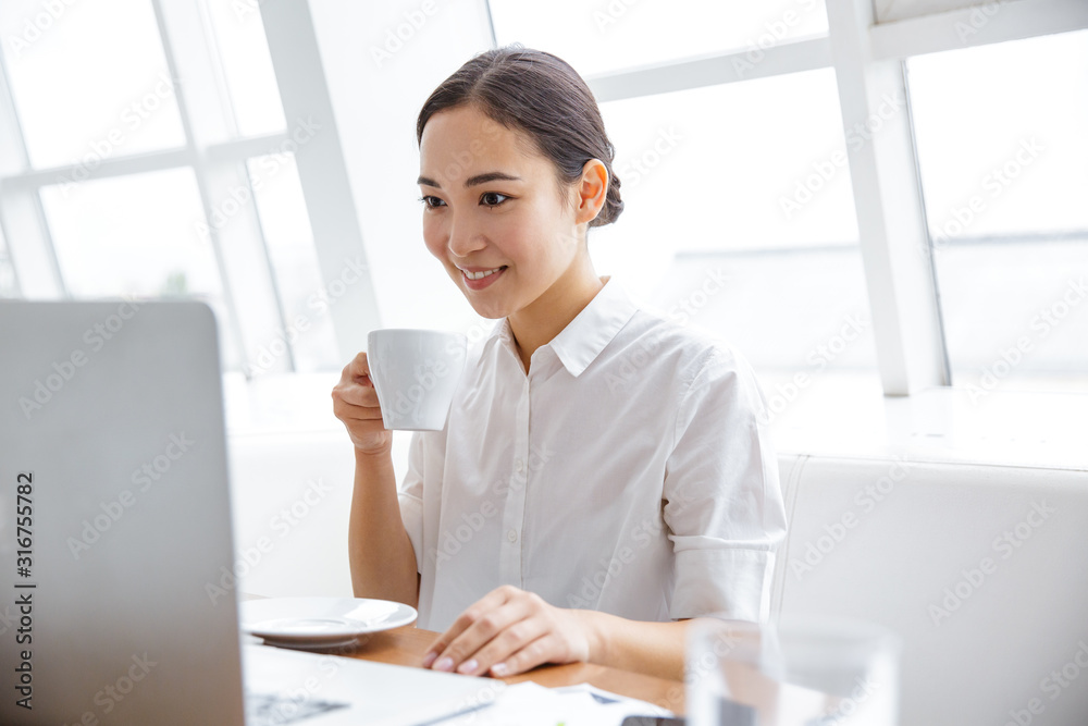 Smiling beautiful asian businesswoman working Smiling beautiful asian businesswoman working