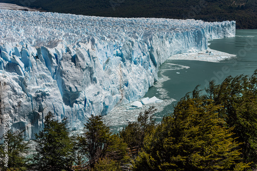 Views of The Perito Moreno Glacier on a sunny day located in the Los Glaciares National Park. Argentina