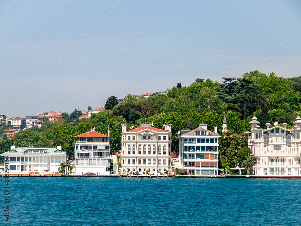 Mansions along the Bosporus Strait in Turkey. Bright summer day. Vibrant colors.