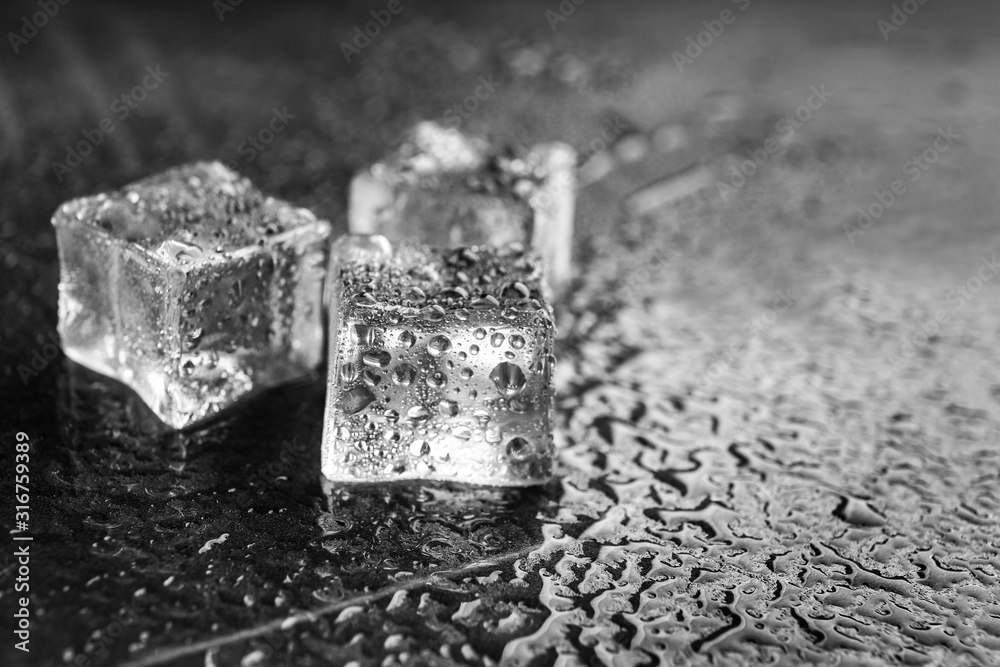Crystal clear ice cubes on grey stone table, closeup. Space for text Crystal clear ice cubes on grey stone table, closeup. Space for text