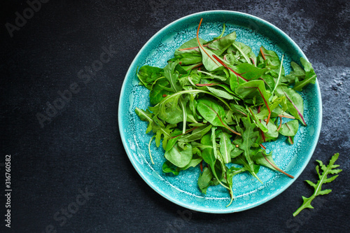 Healthy salad  leaves mix salad  mix micro greens  juicy snack  tomato . food background - Image