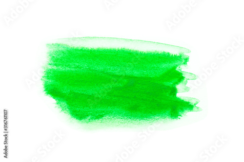 Green watercolor on white background.The color splashing in the paper.It is a hand drawn. For text, element for decoration.