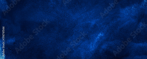 Dark blue watercolor background with torn strokes and uneven divorce. Abstract indigo background for design, template and pattern.