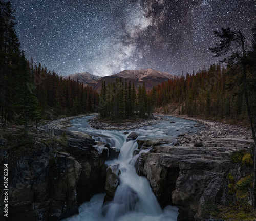 Sunwapta Falls with Milky way in autumn at Icefields Parkway, Jasper national park