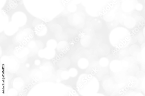 Abstract background with White bokeh on gray background. christmas blurred beautiful shiny Christmas lights.