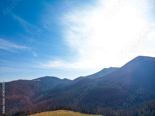 Majestic sunset in the mountains landscape. Aerial view of Dzembronya. Carpathian, Ukraine, Europe.