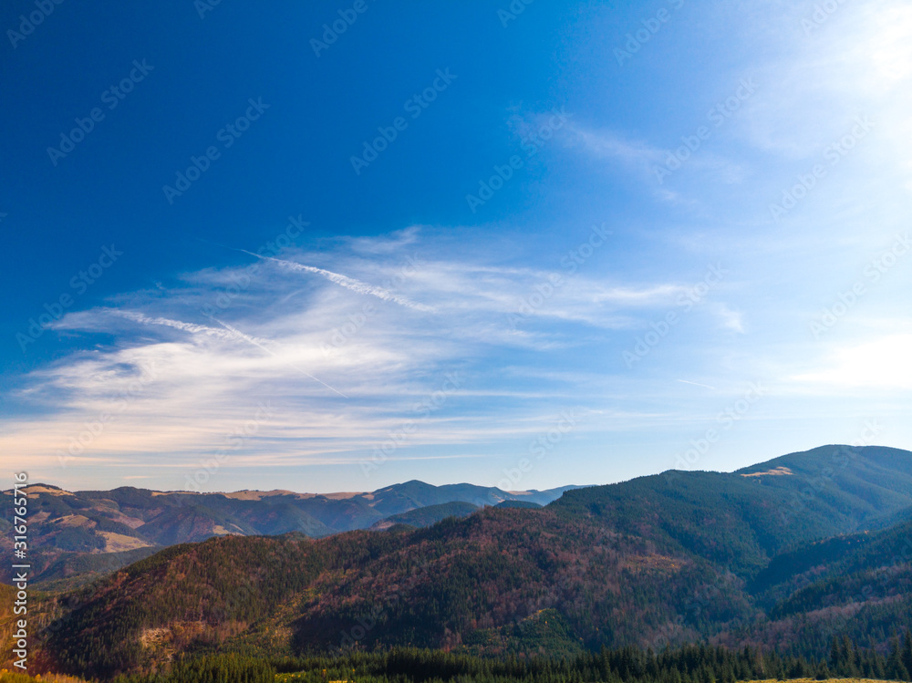 Majestic sunset in the mountains landscape. Aerial view of Dzembronya. Carpathian, Ukraine, Europe.