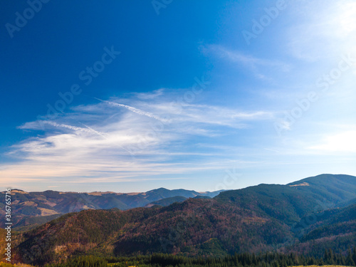 Majestic sunset in the mountains landscape. Aerial view of Dzembronya. Carpathian, Ukraine, Europe.