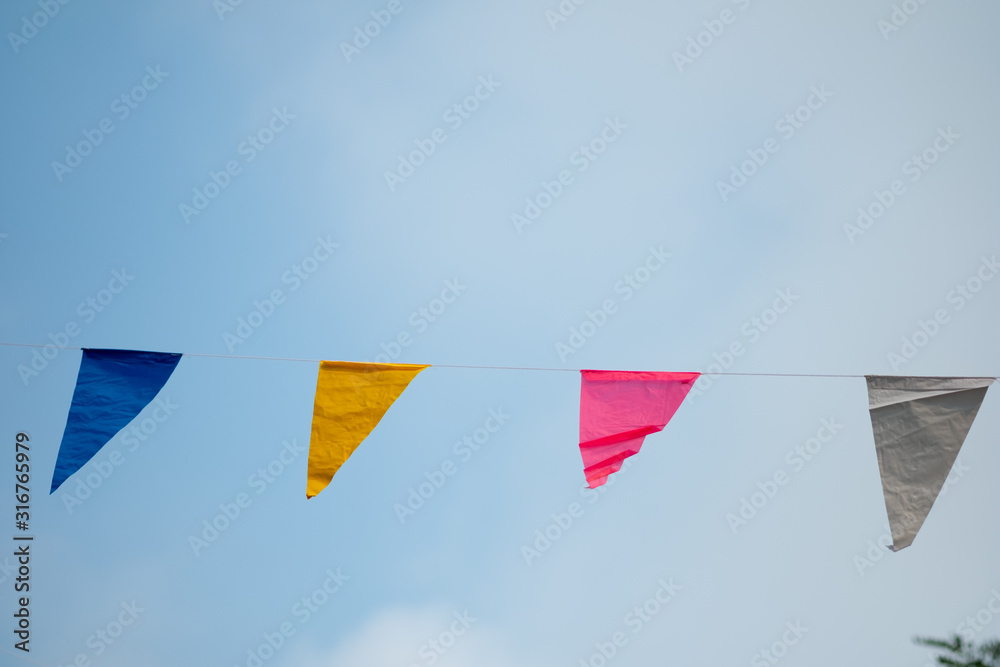 Colorful triangle flags with blue sky Colorful triangle flags with blue sky