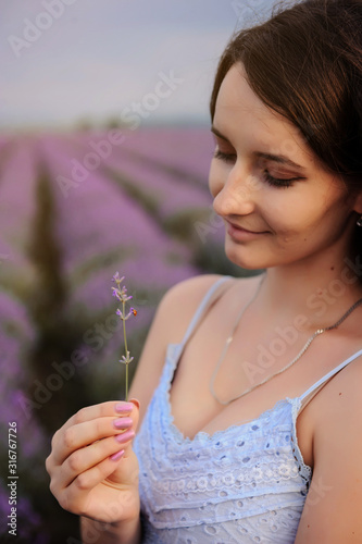 close up photo of a woman in white dress in lavender field