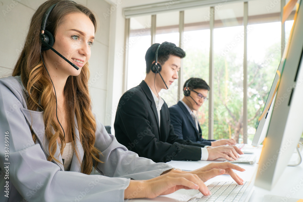 Telesale online marketing work on headphone and computer call to customer business men and women Telesale online marketing work on headphone and computer call to customer business men and women