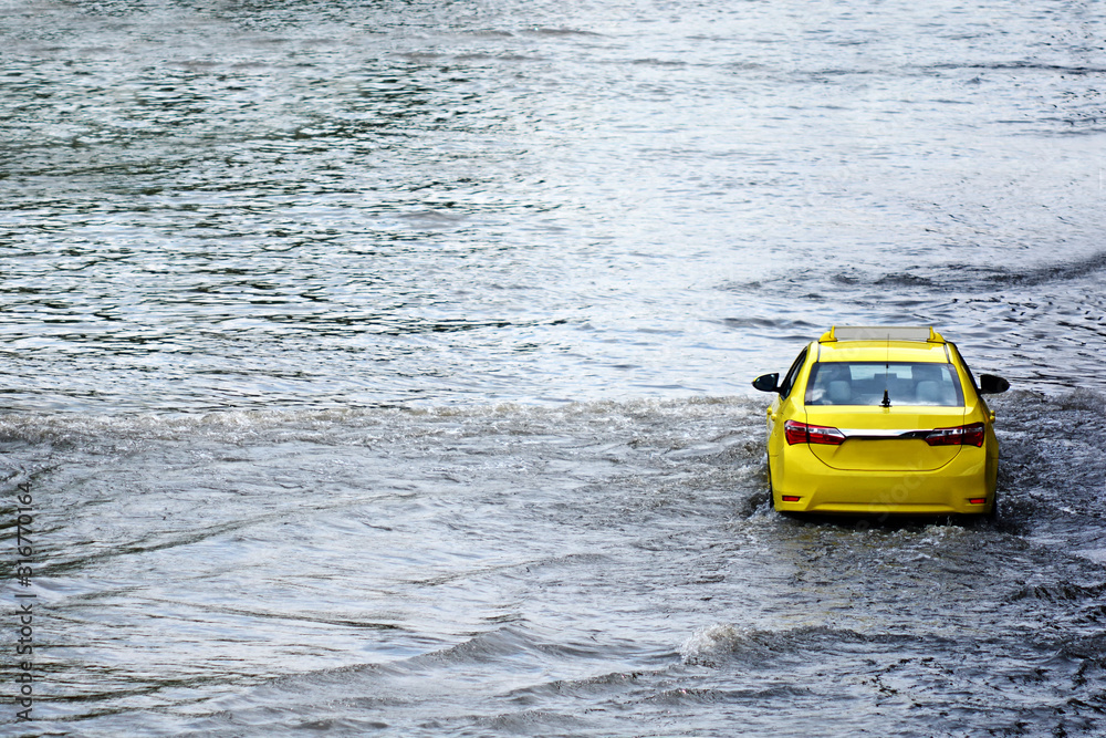 more floods and flooded cars ,car driving flood water on a road more floods and flooded cars ,car driving flood water on a road