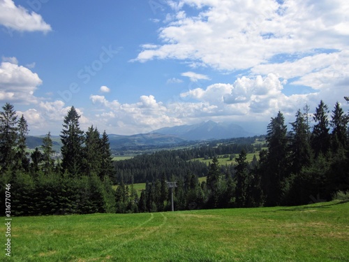 Picturesque landscape - Pieniny mountains, Poland. Cloudy summer day in mountains. Dark clouds over green mountain hills