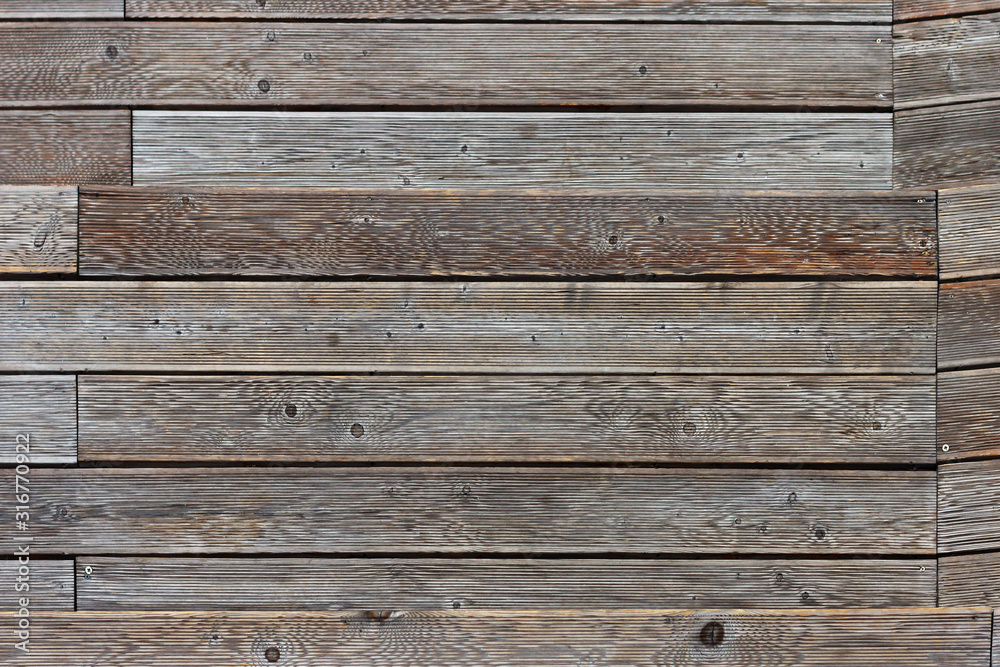 Obraz premium The texture of the old weathered wooden floor