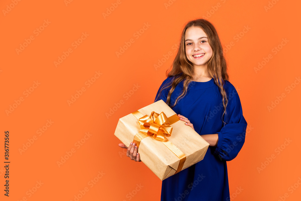 xmas party mood. birthday present for her. little girl after shopping. boxing day concept. ready for holidays. copy space. cheerful kid hold big present box. happy new year. open christmas gift xmas party mood. birthday present for her. little girl after shopping. boxing day concept. ready for holidays. copy space. cheerful kid hold big present box. happy new year. open christmas gift