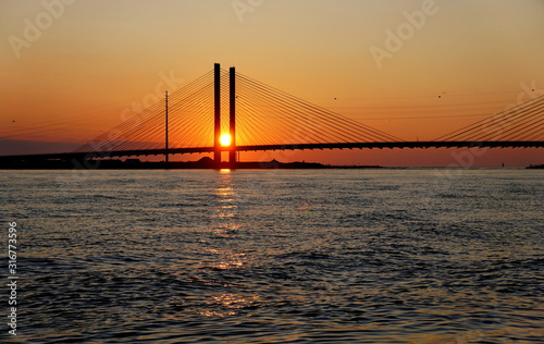 Beautiful view of sunrise near Indian River Bridge, Bethany Beach, Delaware, U.S.A © K.A