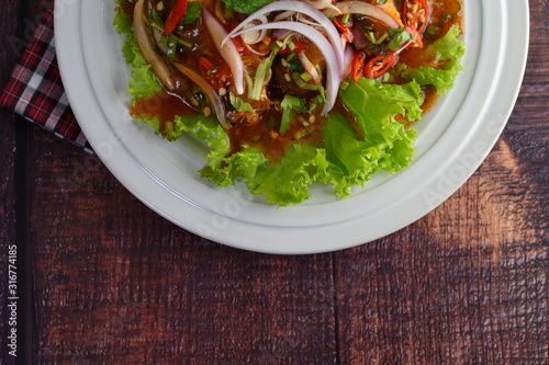 Spicy salad of sardine in tomato sauce inviting hungry