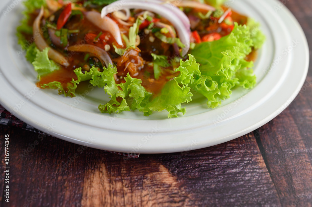 Spicy salad of sardine in tomato sauce inviting hungry