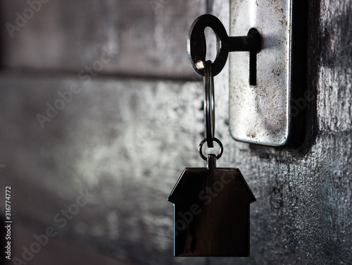 House shape keyring on a door lock.
