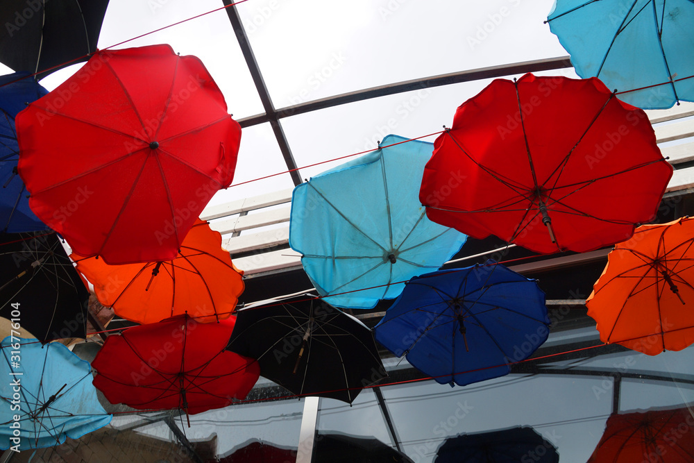 multi-colored umbrellas suspended from the ceiling
