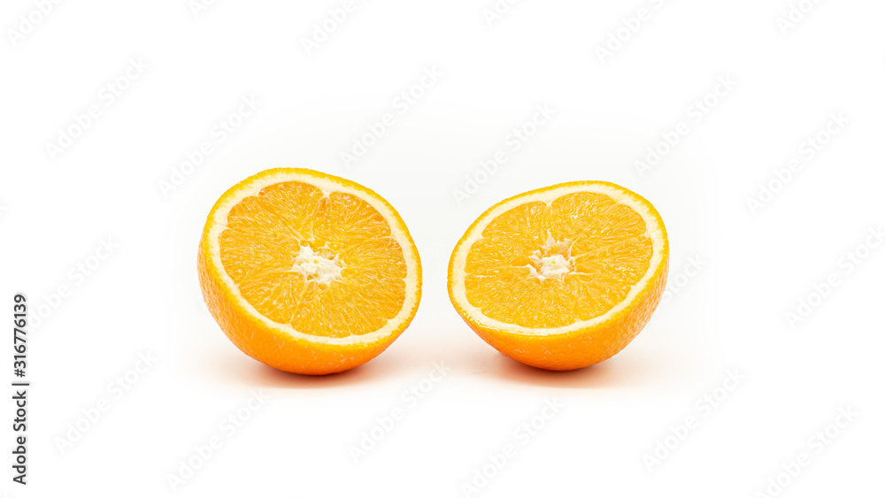 Orange cut in a half on a white background. Isolated Orange cut in a half on a white background. Isolated
