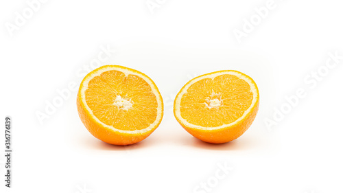 Orange cut in a half on a white background. Isolated