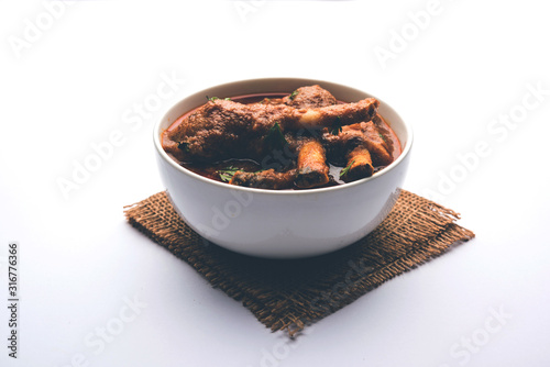 Hyderabadi Mutton Paya, Nehari, nahari or Nihari Masala. served with Naan and rice. selective focus photo