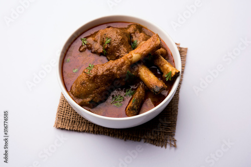 Hyderabadi Mutton Paya, Nehari, nahari or Nihari Masala. served with Naan and rice. selective focus photo