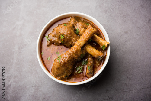 Hyderabadi Mutton Paya, Nehari, nahari or Nihari Masala. served with Naan and rice. selective focus photo