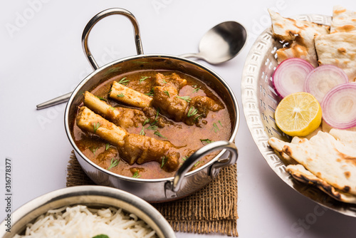 Hyderabadi Mutton Paya, Nehari, nazari or Nihari Masala. served with Naan and rice. selective focus photo