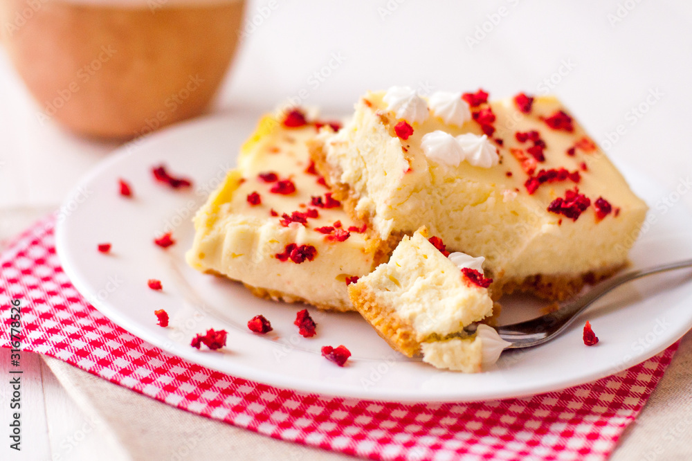 Homemade cheesecake pieces with dried strawberry Homemade cheesecake pieces with dried strawberry