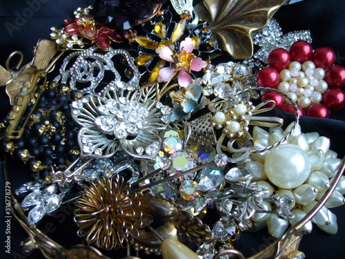 Vintage jewelry close-up. Old brooches with rhinestones.