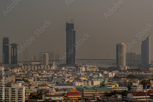 Aerial view of Bangkok evening view with skyscraper buildings and blue sky  Landscape photo.