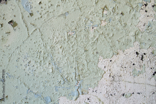 Old wall with peeling paint photo