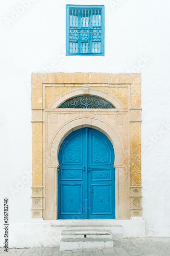 Typical local  painted door of traditional home Tunisia, Sidi Bou Said © Viktoryia