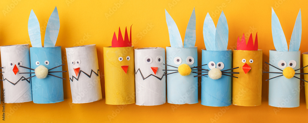Happy easter kindergarten decoration concept - rabbit, chicken, egg from toilet paper roll tube. Simple diy creative idea, copy space. Eco-friendly reuse recycle decor, banner