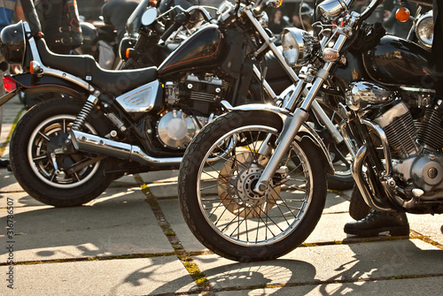 Many motorcycles on the biker show. Motorcycle elements closeup. City Bikers Festival. © Ivan