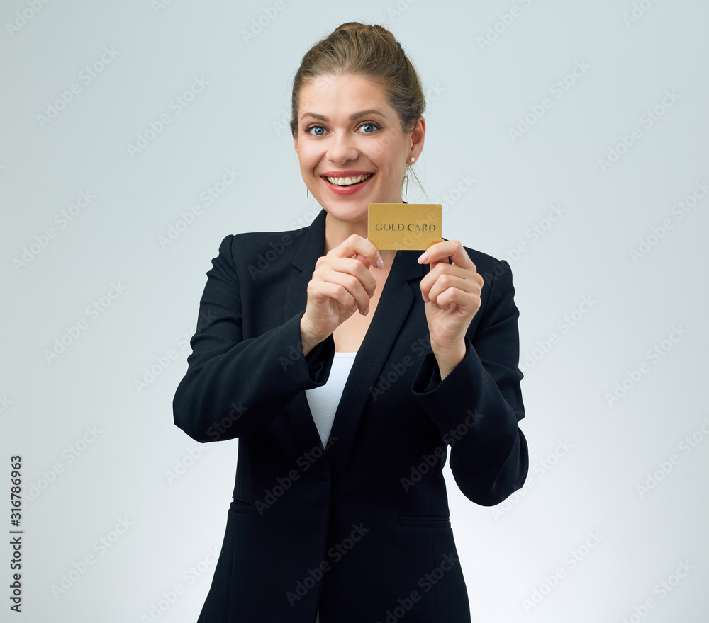 Happy woman in black jacket holding credit card. Happy woman in black jacket holding credit card.