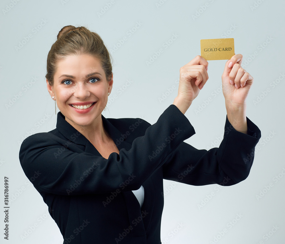 woman in black business suit holding raised hands with gold credit card woman in black business suit holding raised hands with gold credit card