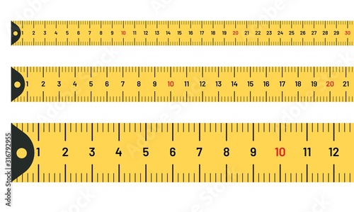 Ruler measuring long tape set. Yellow tape lines with inches and metric centimetres